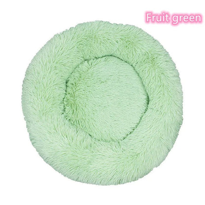 Chat se reposant dans le coussin donut ultra-doux